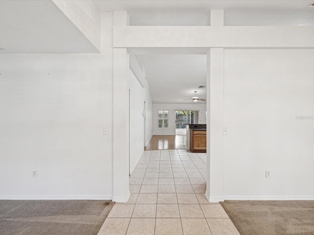 corridor with light tile patterned flooring