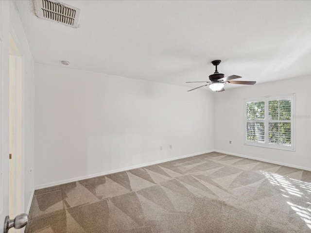 empty room with light carpet and ceiling fan