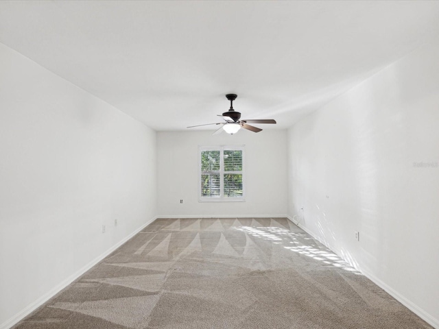 empty room with light carpet and ceiling fan