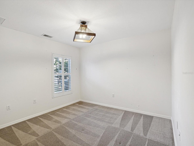 empty room featuring carpet flooring