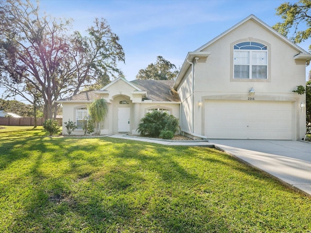 view of front facade featuring a front lawn and a garage