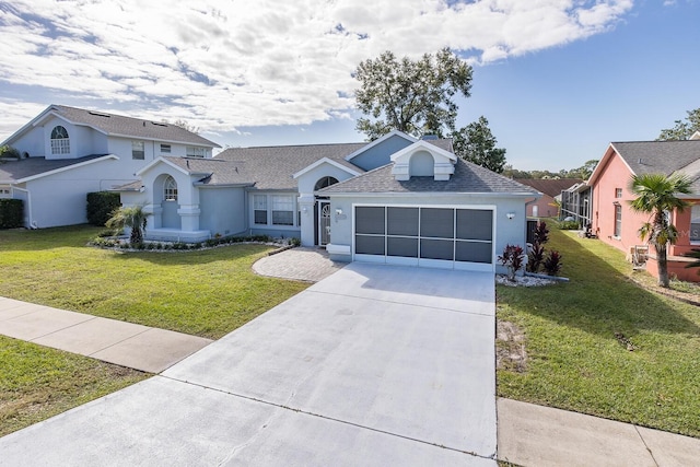 view of front facade with a front lawn and a garage