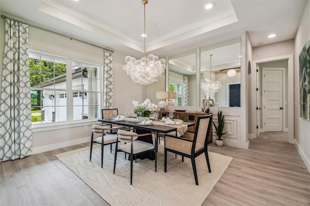 dining space with light hardwood / wood-style floors and a wealth of natural light