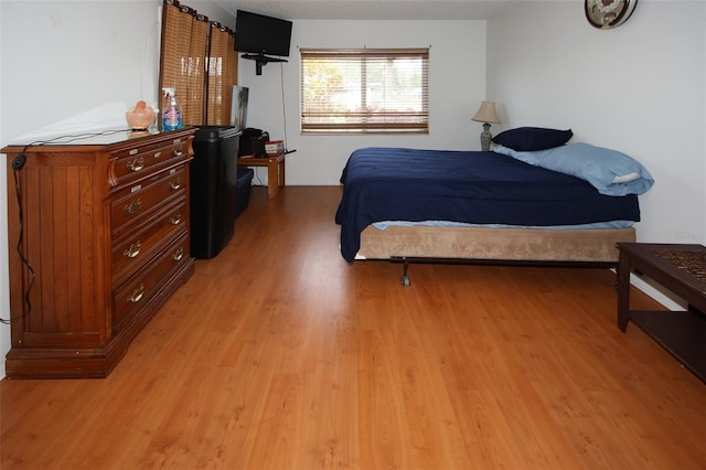 bedroom with light hardwood / wood-style flooring