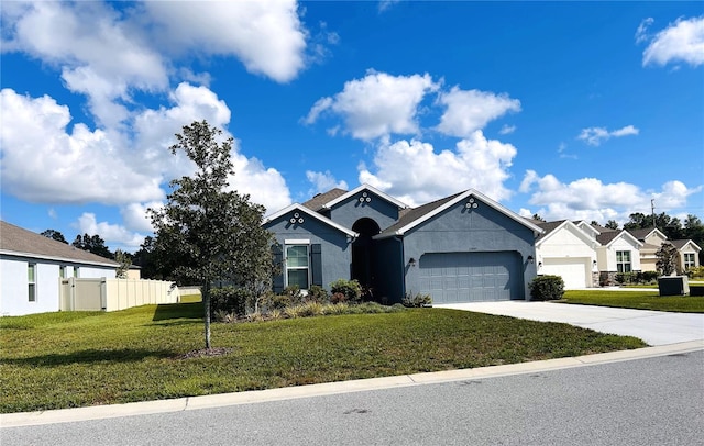 single story home with a front yard and a garage