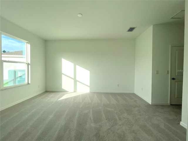 unfurnished room with light colored carpet