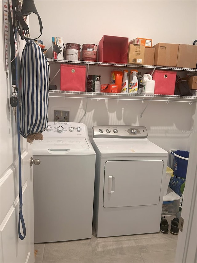 laundry room with independent washer and dryer