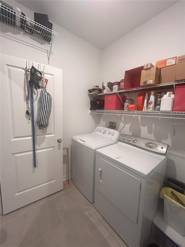 washroom with washing machine and dryer