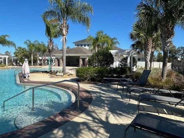 view of swimming pool featuring a patio