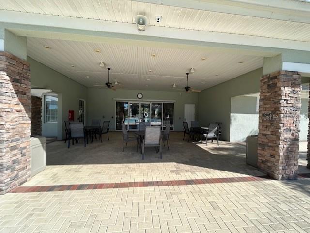 view of patio / terrace featuring ceiling fan