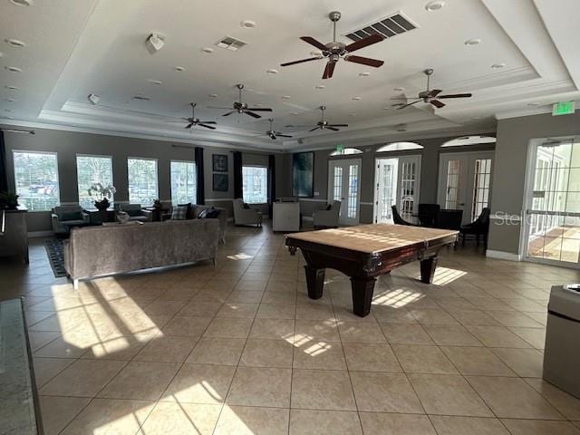 game room featuring light tile patterned floors, french doors, billiards, and a raised ceiling