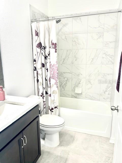 13447 Newport Shores Dr, Hudson, FL 34669 - full bath with vanity and shower / bath combo with shower curtain
