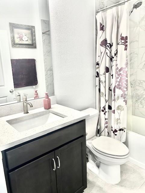 13447 Newport Shores Dr, Hudson, FL 34669 - bathroom featuring vanity and shower / tub combo