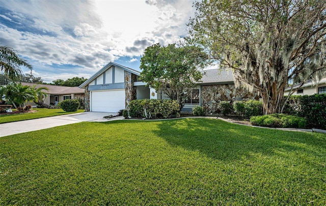 view of front of property featuring a garage and a front lawn