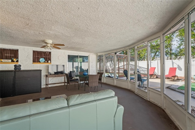 sunroom featuring ceiling fan