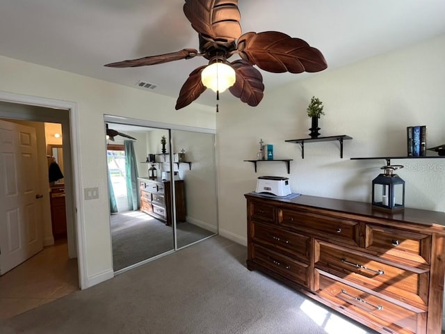 bedroom with a closet, carpet flooring, and ceiling fan