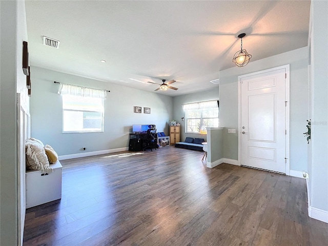 entryway featuring ceiling fan and dark hardwood / wood-style floors