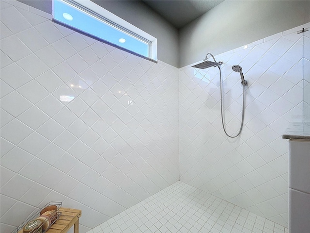 bathroom with tiled shower