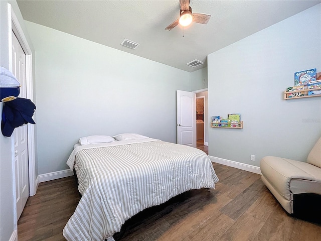 bedroom with ceiling fan and dark hardwood / wood-style flooring