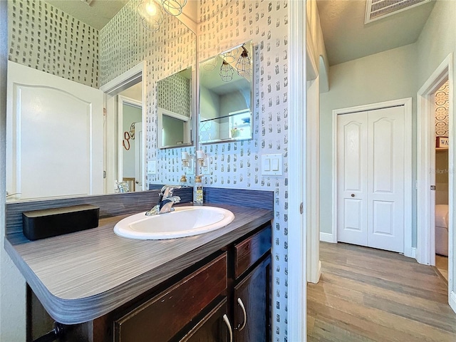 bathroom featuring vanity and hardwood / wood-style floors