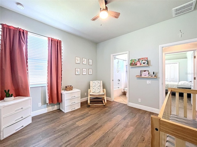 sitting room with hardwood / wood-style flooring and ceiling fan