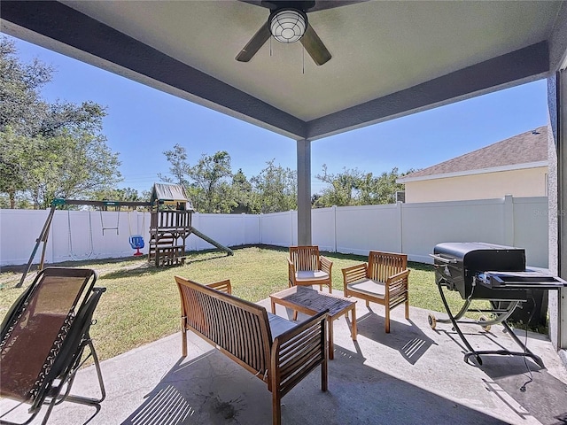 view of patio / terrace with ceiling fan and a playground