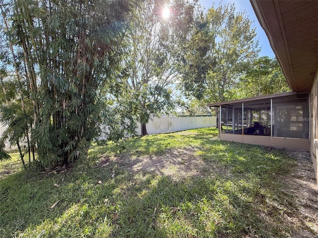 view of yard with a sunroom