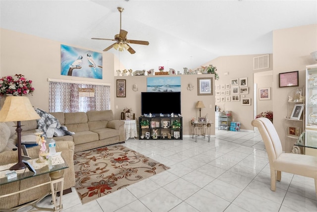 living room with ceiling fan, light tile patterned flooring, and vaulted ceiling