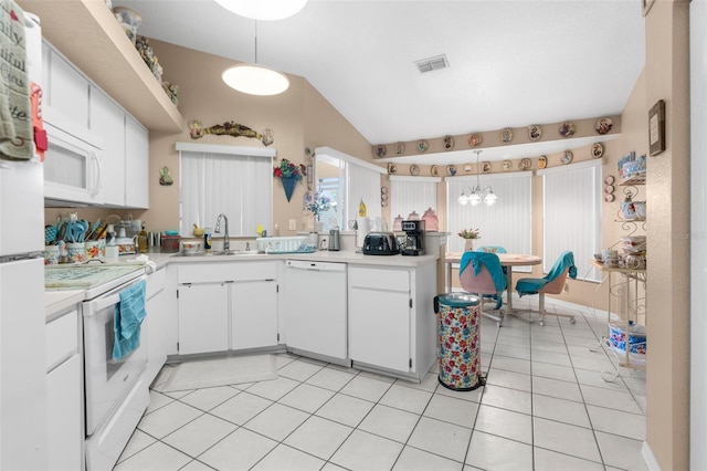 kitchen featuring sink, white cabinetry, pendant lighting, and white appliances