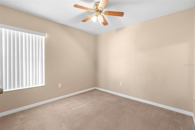 empty room with carpet floors and ceiling fan