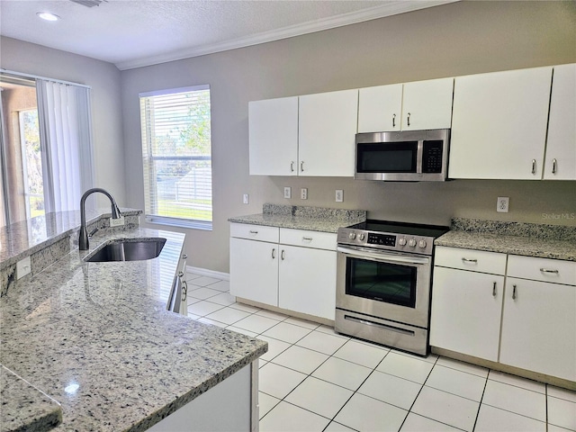 kitchen featuring white cabinets, light tile patterned floors, and stainless steel appliances