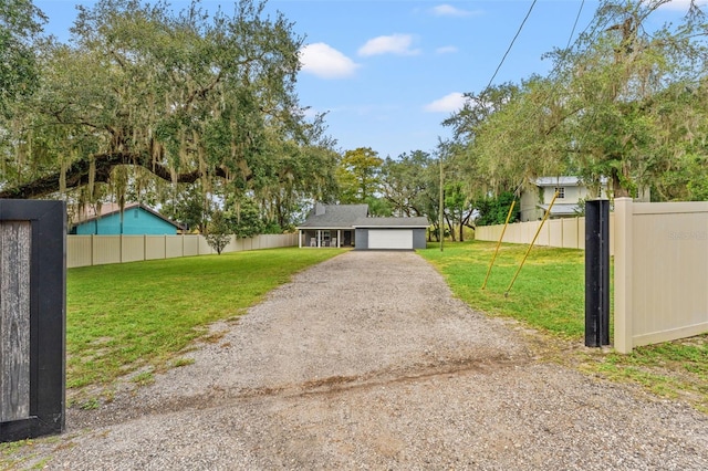 exterior space featuring a front yard and a garage