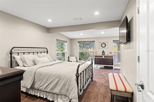 bedroom with dark colored carpet