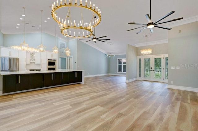 unfurnished living room featuring ceiling fan, light wood-type flooring, french doors, and ornamental molding