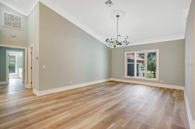 unfurnished room with ornamental molding, light hardwood / wood-style floors, and an inviting chandelier