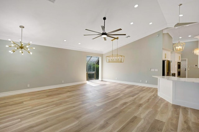 unfurnished living room featuring light hardwood / wood-style floors, lofted ceiling, ceiling fan, and crown molding