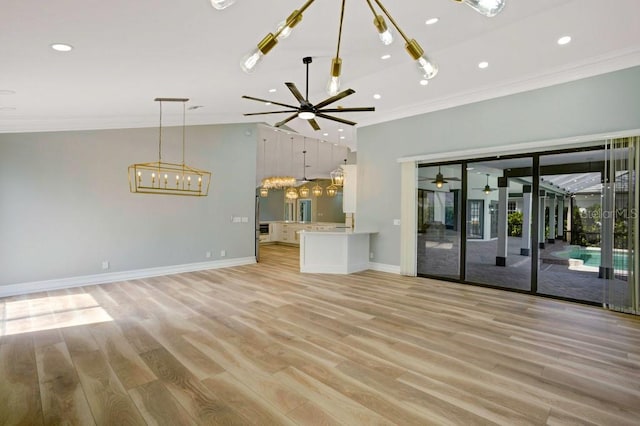 unfurnished living room with crown molding and light hardwood / wood-style flooring