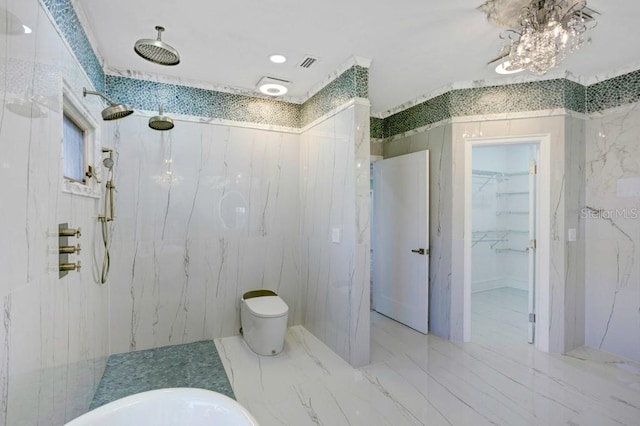 bathroom with toilet and a tile shower