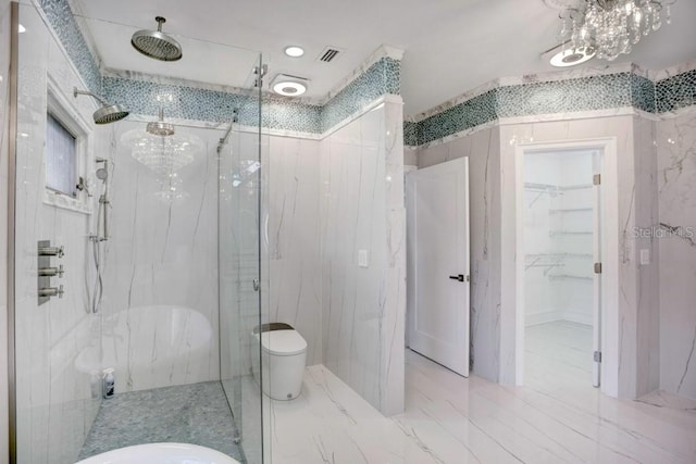 bathroom featuring toilet and a tile shower