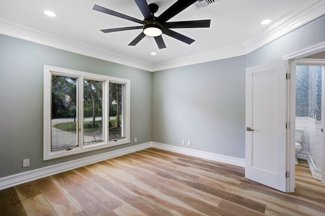 unfurnished room featuring ceiling fan, light hardwood / wood-style flooring, and crown molding