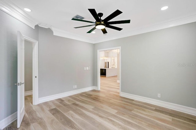 unfurnished room with ceiling fan, ornamental molding, and light hardwood / wood-style flooring