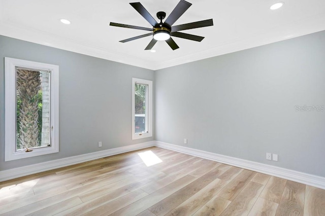 spare room featuring ornamental molding, ceiling fan, and light hardwood / wood-style flooring