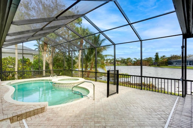 view of pool featuring a lanai, a water view, an in ground hot tub, and a patio area