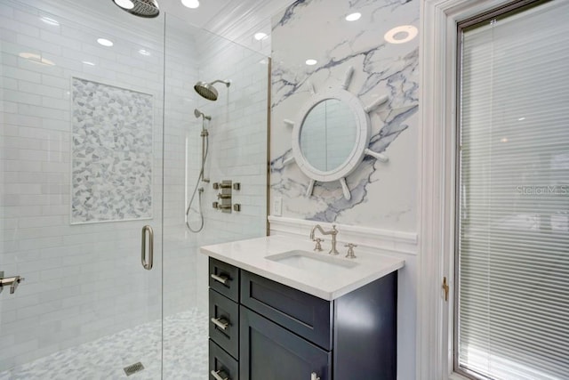 bathroom featuring vanity and an enclosed shower