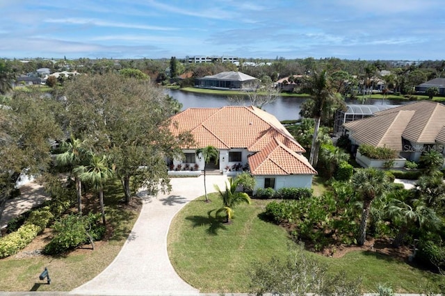 birds eye view of property with a water view