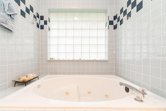 bathroom with a tub to relax in