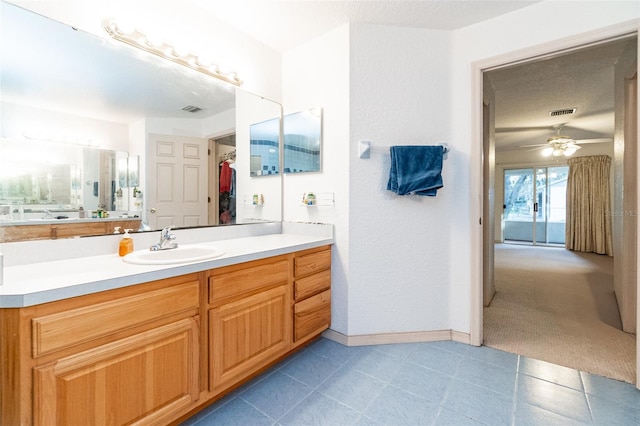 bathroom featuring vanity, tile patterned floors, and ceiling fan