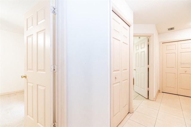 hallway with light tile patterned floors