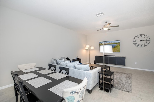 dining room featuring light tile patterned flooring and ceiling fan