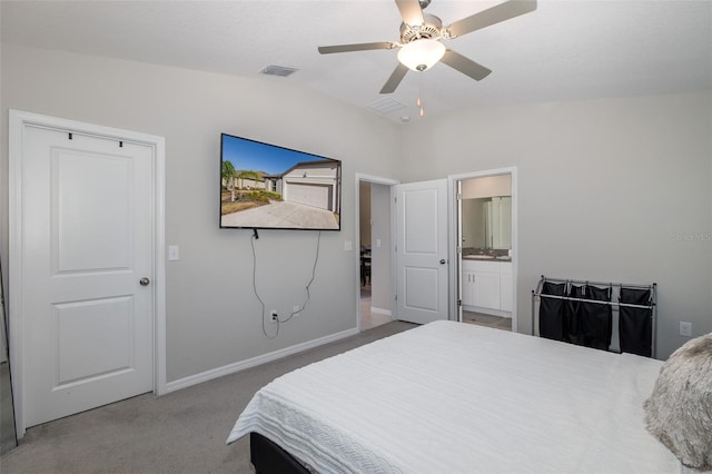 carpeted bedroom with lofted ceiling, ensuite bathroom, and ceiling fan